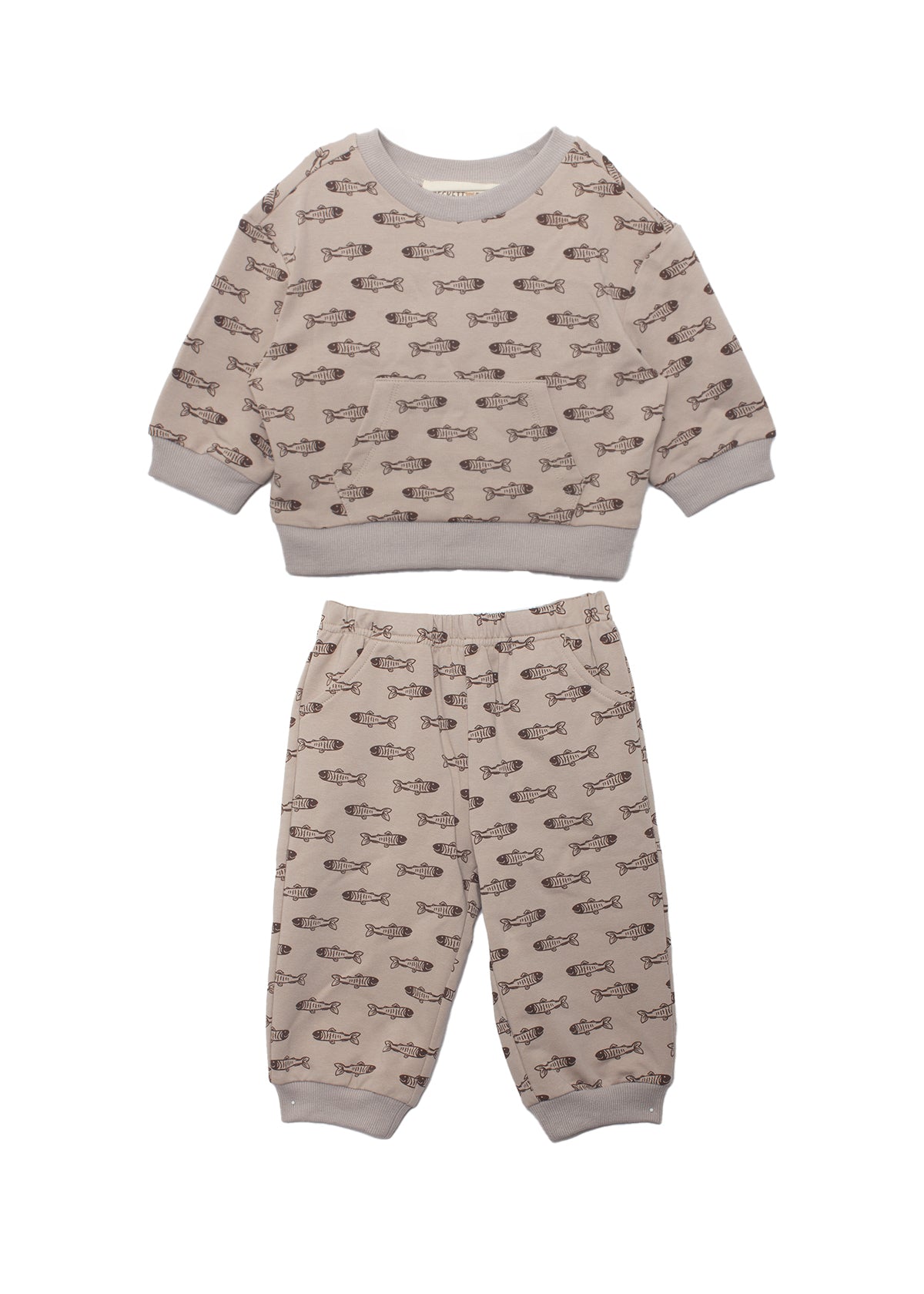 The Isaiah Two Piece Set by Beckett and Bear is a beige toddler outfit featuring a long-sleeve top and pants with an all-over brown animal print and playful fish motif.