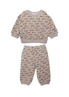 The Isaiah Two Piece Set by Beckett and Bear is a beige toddler outfit featuring a long-sleeve top and pants with an all-over brown animal print and playful fish motif.