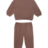 The Beckett and Bear Theo Two Piece Set features a cozy brown checkered long-sleeve sweatshirt with a front pocket and matching jogger pants with elastic cuffs and side pockets, perfect children’s loungewear, shown laid flat on white.