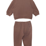 The Beckett and Bear Theo Two Piece Set for kids features a brown checkered plaid design with a long-sleeve top and matching elastic-cuff pants, both shown flat on a white background.