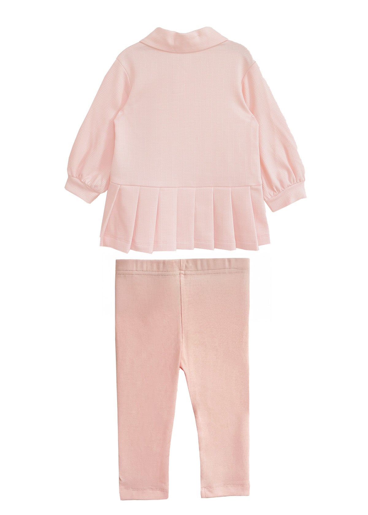 The Serena Two Piece Set by Mabel and Honey is a pink girls’ outfit with a long-sleeve top featuring a pleated hem and collar, paired with matching elastic-waist leggings, shown on a white background.