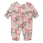 The Bow-tiful Romper by Mabel and Honey is a charming long sleeve baby girl romper with ruffled cuffs and playful pink, red, and green bows on white, finished with gathered waist and ankles.