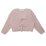 The Isobella and Chloe Ballerina Sweater features a light pink, long-sleeve, cropped waffle-knit design with a V-neckline and two front tie closures. The label is visible inside the neckline.