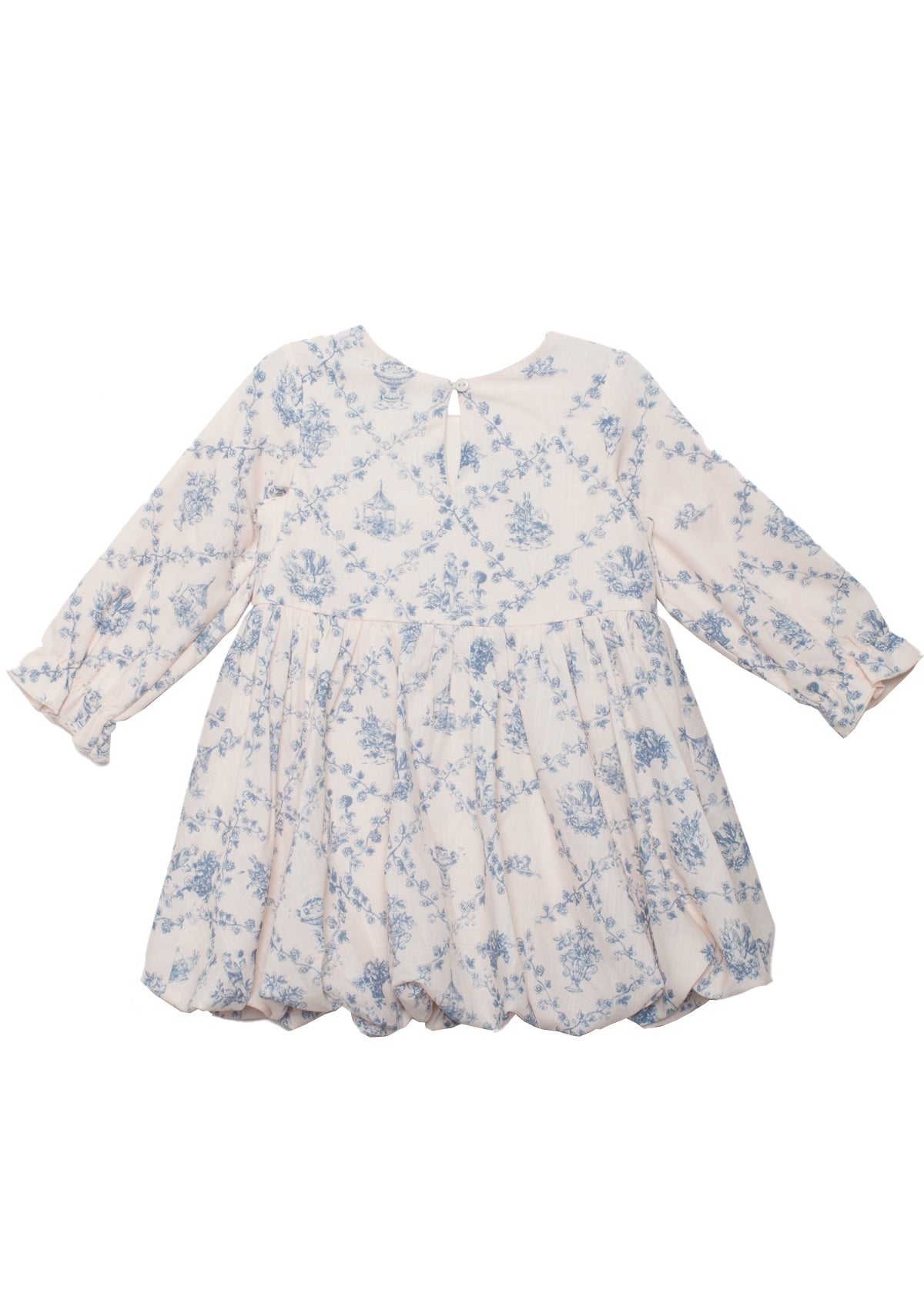 The Mabel and Honey Princess Dress is a long-sleeved white baby dress with a blue toile floral pattern, round neckline, gathered skirt, loose fit, and back button—perfect for special occasions.