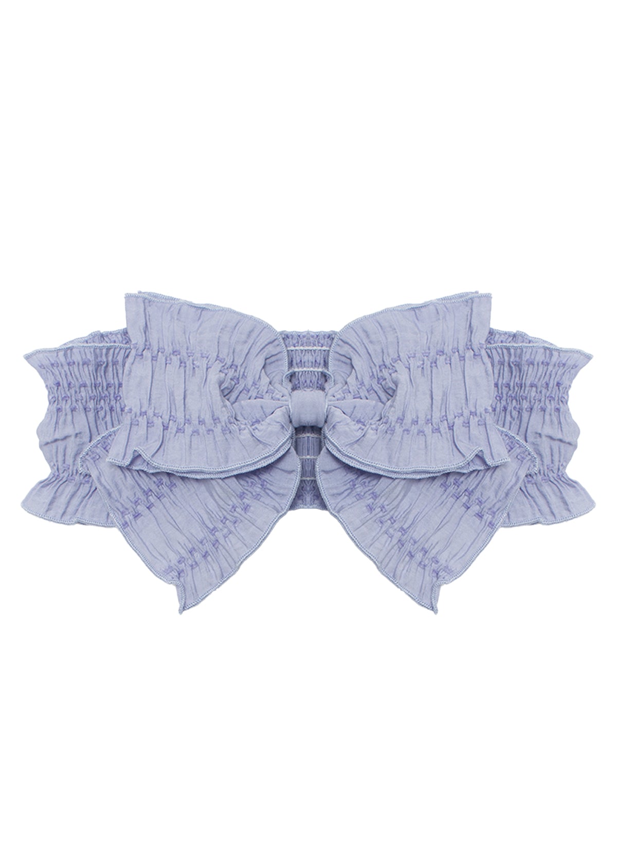 The Lena Hair Accessory by Mabel and Honey features a light lavender hue, a large ruched bow at the center, and a textured elastic band for stylish comfort.