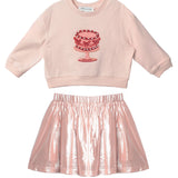 The Isobella and Chloe Sweet Cakes Two Piece Set features a light pink embroidered cake long-sleeve top and a shiny metallic pink skirt—perfect for sweet style in any girl’s wardrobe.