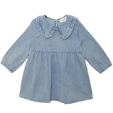 The Mabel and Honey Denim Days Long Sleeve Dress is a charming light blue denim A-line dress for kids, featuring a ruffled Peter Pan collar and gathered waist, shown on a white background.