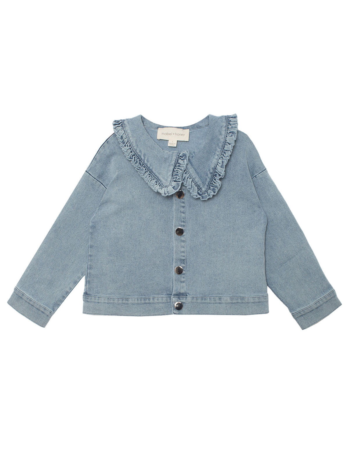The Denim Days Ruffled Collar Jacket by Mabel and Honey features light blue denim, a wide ruffled collar, long sleeves, front buttons, and simple cuffs—perfect for a casual, slightly loose kids’ fit.