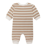 The Beckett and Bear Mason Romper is a baby one-piece with long sleeves and legs, featuring beige and white horizontal stripes, solid white cuffs, neckline, and leg openings. Shown laid flat on a white background.