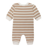 The Beckett and Bear Mason Romper is a baby one-piece with long sleeves and legs, featuring beige and white horizontal stripes, solid white cuffs, neckline, and leg openings. Shown laid flat on a white background.