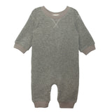 The Beckett and Bear Miles Romper is a gray, long-sleeved boys romper with ribbed cuffs and neckline, collar stitching detail, leg snaps for easy changing, and a minimalist design.