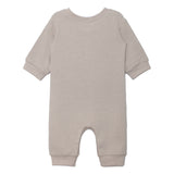 The Beckett and Bear Isaac Romper is a light beige, neutral-tone one-piece with cuffed sleeves and legs. Shown flat from the back, its simple solid design has no visible patterns or decorations.