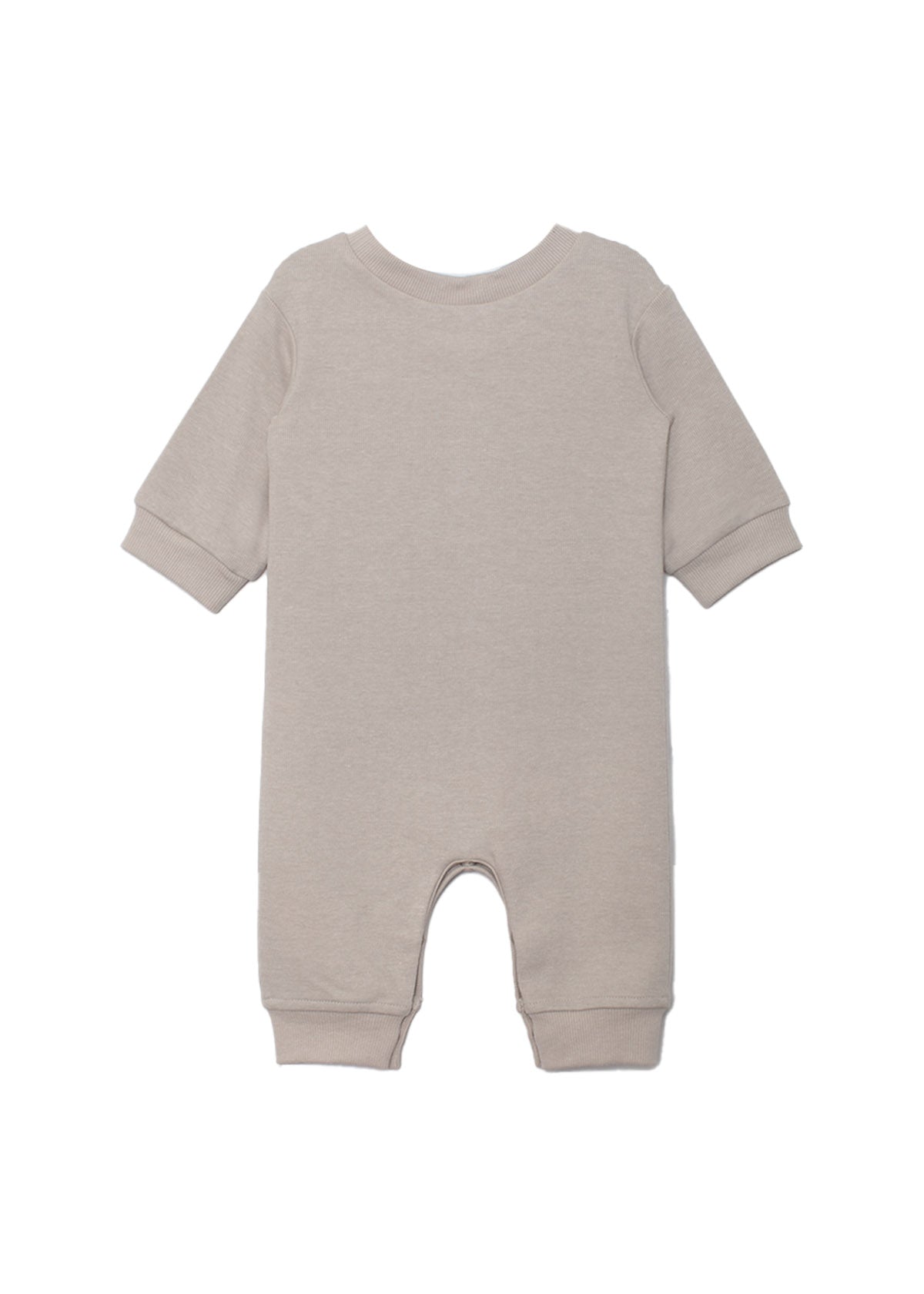The Beckett and Bear Isaac Romper is a light beige, neutral-tone one-piece with cuffed sleeves and legs. Shown flat from the back, its simple solid design has no visible patterns or decorations.