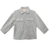 The Beckett and Bear Grayson Jacket is a light gray, long-sleeve corduroy jacket for kids with a collar, two chest pockets, and front button closure—ideal as a layering piece on cool days.