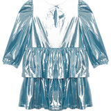The Isobella and Chloe Blue Stardust Dress features a shiny metallic light blue finish, three-quarter puff sleeves, a round neckline with a front keyhole, and two tiered ruffle skirt layers—ideal for any special occasion.