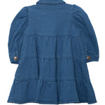 The Denim Days Tiered Dress by Mabel and Honey is a girls’ long-sleeved blue denim dress with a collar, buttoned cuffs, and a flared tiered skirt, shown flat with the back side facing up.
