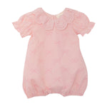 The Mabel and Honey Lacy Bowkisses Short Sleeve Romper features a pink bow pattern, scalloped lace collar, puffed sleeves, elastic leg openings, and offers a soft, adorable look.