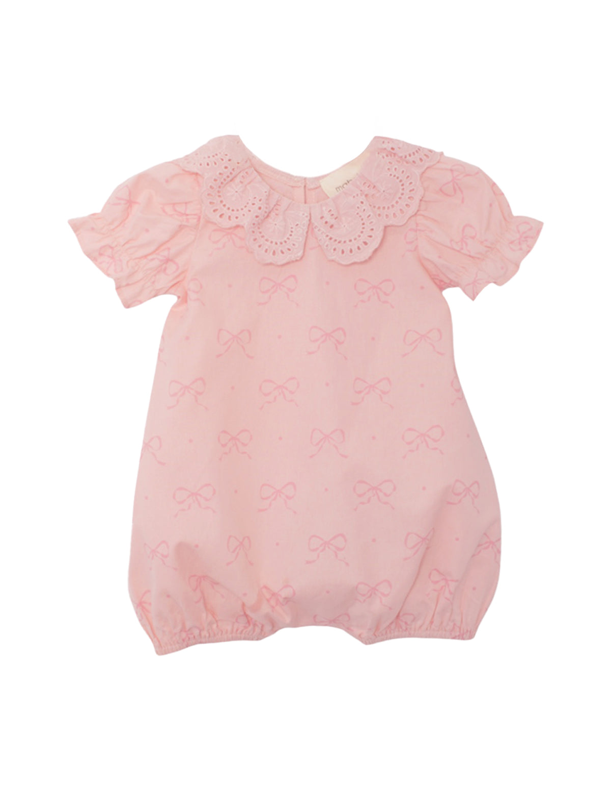 The Mabel and Honey Lacy Bowkisses Short Sleeve Romper features a pink bow pattern, scalloped lace collar, puffed sleeves, elastic leg openings, and offers a soft, adorable look.