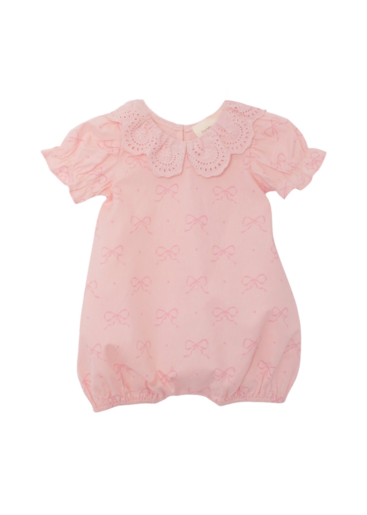 The Mabel and Honey Lacy Bowkisses Short Sleeve Romper features a pink bow pattern, scalloped lace collar, puffed sleeves, elastic leg openings, and offers a soft, adorable look.