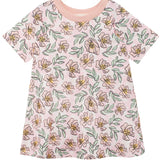 The Quinn Short Sleeve Dress by Mabel and Honey is a light pink, breathable dress with yellow and pink floral patterns, green leaves, and a solid collar—perfect for comfortable everyday wear.