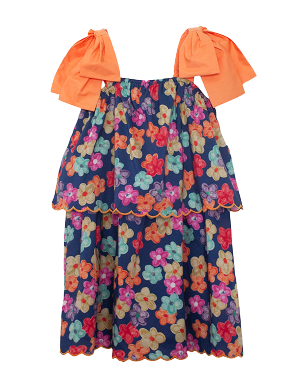 The Fiesta Cap Sleeve Dress by Mabel and Honey features bold orange bow straps, a navy blue base with colorful floral prints, and a scalloped hem. Its tiered, flowy design ensures comfortable wear for any day.