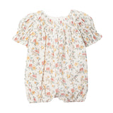 The Mabel and Honey Audrey Flutter Sleeve Romper is a white baby romper with short puff sleeves, elastic leg openings, and a charming pink, yellow, and green floral pattern for comfort and style.