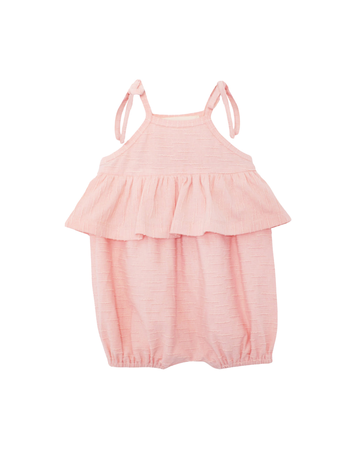 The Pinky Linky Sleeveless with Knot Detail Romper by Mabel and Honey features shoulder tie straps, a ruffled chest overlay, elastic leg openings, and a subtle textured knit pattern in light pink against a plain white background.