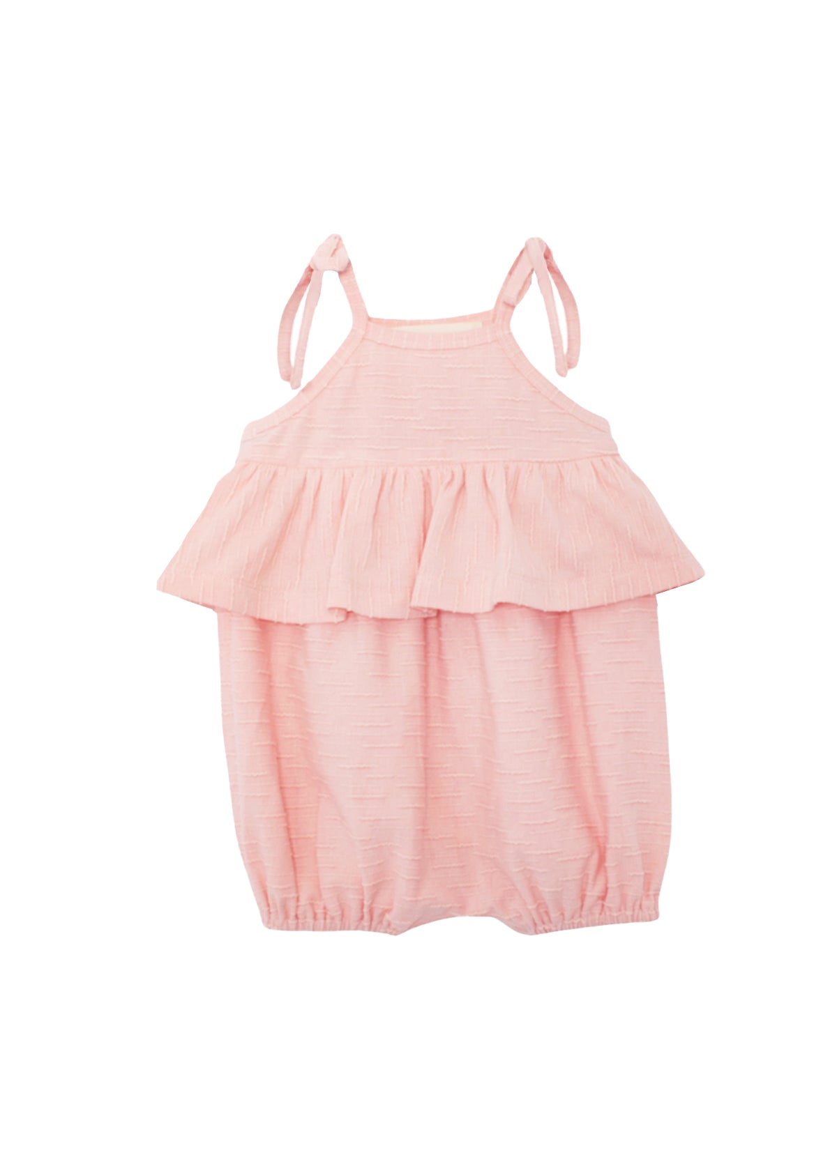 The Pinky Linky Sleeveless with Knot Detail Romper by Mabel and Honey features shoulder tie straps, a ruffled chest overlay, elastic leg openings, and a subtle textured knit pattern in light pink against a plain white background.