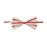 Terracotta Stripe Hair Accessory by Mabel and Honey, featuring a classic bow design with diagonal terracotta stripes, shown on a white background.
