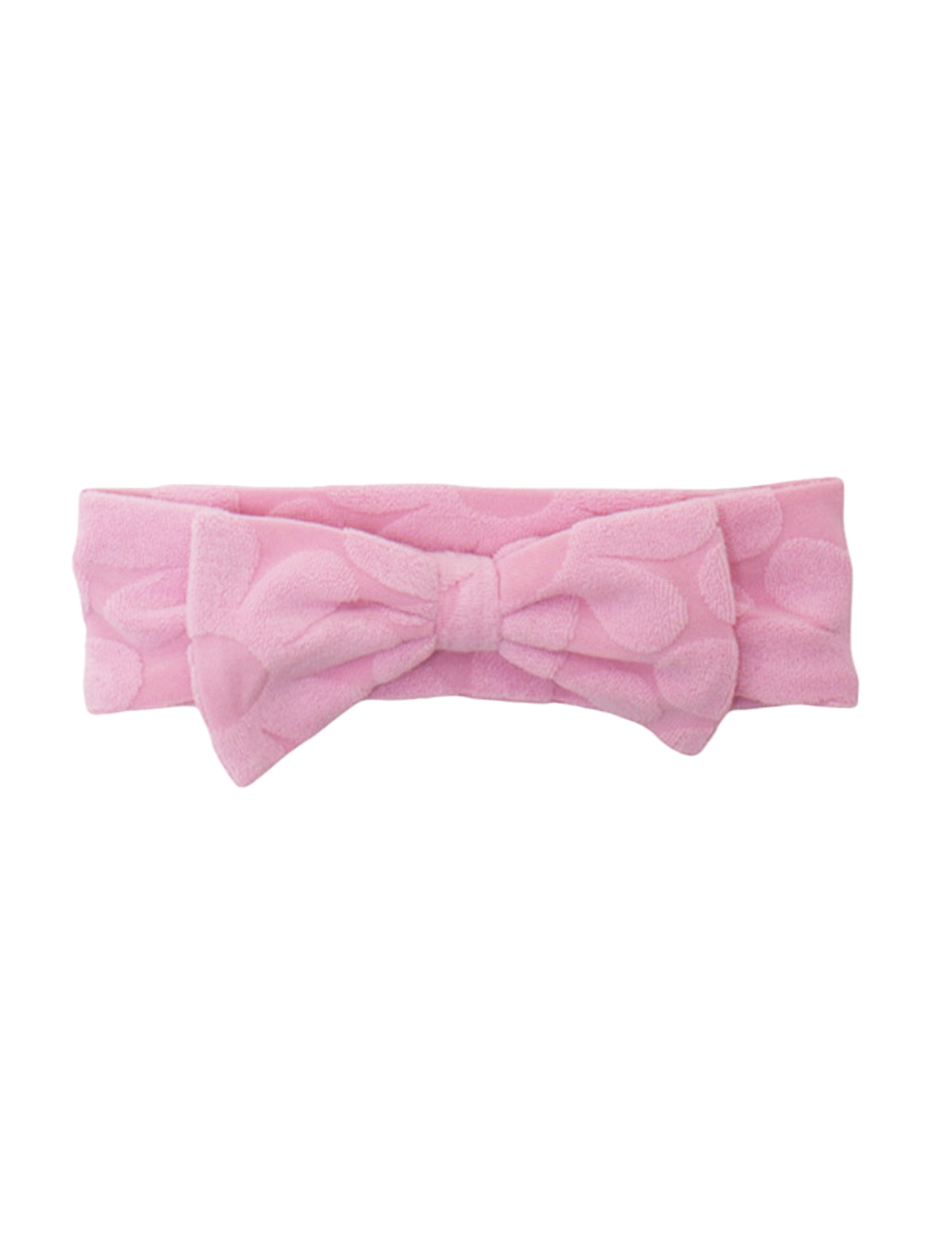 The Tilly Hair Accessory by Mabel and Honey is a soft pink terrycloth headband with a textured pattern and a large center bow, making it both adorable and comfortable.