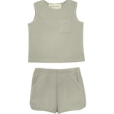 The Russell Sleeveless Two Piece Set by Beckett and Bear features a light grey waffle-knit top with a chest pocket and matching shorts with an elastic waistband and side pockets, displayed on a white background.