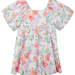 The Lavender Daze Puff Sleeve Dress by Mabel and Honey features short puffy sleeves, a gathered waist, and a pastel floral watercolor print in pink, orange, and purple on white.
