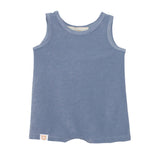 The Axel Sleeveless Romper by Beckett and Bear is a light blue, terry cloth baby romper with a round neckline, sleeveless design, and a small beige tag at the bottom left hem.