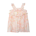 The Sundrop Floral Empire Waist Dress by Isobella and Chloe is a sleeveless pink and white hand-woven dress for girls, with ruffled straps, double ruffle chest detail, and a loose fit—perfect for summer comfort and charm.