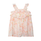 The Sundrop Floral Empire Waist Dress by Isobella and Chloe is a sleeveless pink and white hand-woven dress for girls, with ruffled straps, double ruffle chest detail, and a loose fit—perfect for summer comfort and charm.