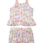 The Mabel and Honey Tulip Twirl Tank Two Piece Set features a sleeveless top and shorts with pink, purple, and orange flowers on a light background—perfect summer clothes or a cute toddler outfit.
