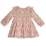 The Mabel + Honey Autumn Floral Tan Long Sleeve Dress for girls features a red floral print, ruffled shoulders, smocked bodice, flared skirt, and keyhole back for charming style and easy dressing.