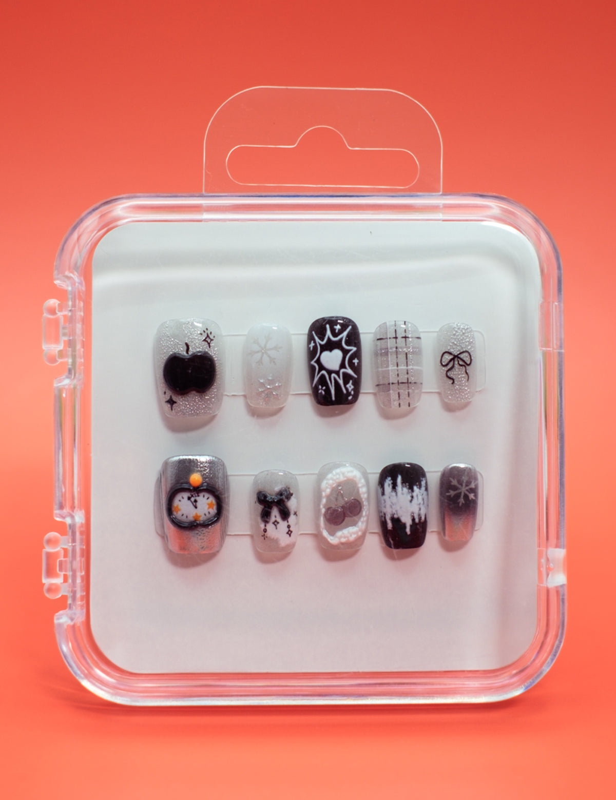Mabel and Honey’s Hocus Pocus press-on nails come in a clear case and feature black, white, and orange designs—stars, hearts, plaid, bows, and Halloween-themed patterns—for a salon-quality manicure.