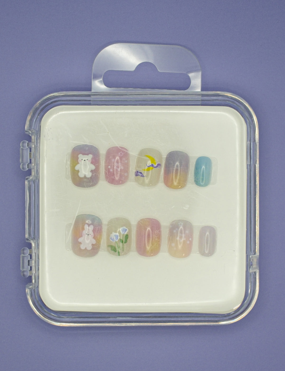Garden Candy by Mabel and Honey: colorful reusable nails with a white bear, yellow chick, flowers, and pastel gradients in a clear case—perfect for a salon-quality manicure at home.