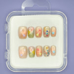 Stars and Sprinkles by Mabel and Honey is a reusable nail set with colorful press-ons, pastel star stickers, geometric patterns, and confetti dots, all in a clear case for a salon-quality manicure.
