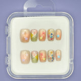Stars and Sprinkles by Mabel and Honey is a reusable nail set with colorful press-ons, pastel star stickers, geometric patterns, and confetti dots, all in a clear case for a salon-quality manicure.