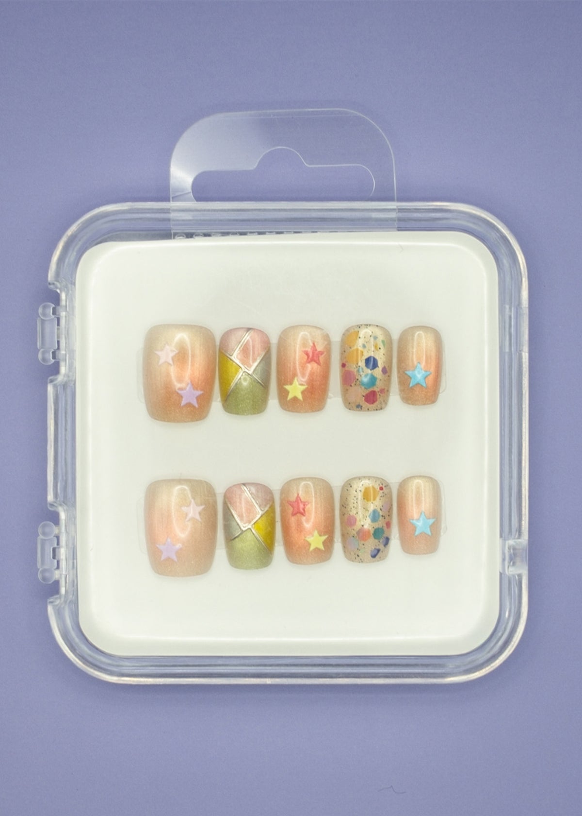 Stars and Sprinkles by Mabel and Honey is a reusable nail set with colorful press-ons, pastel star stickers, geometric patterns, and confetti dots, all in a clear case for a salon-quality manicure.