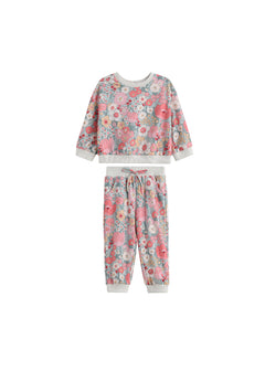 The Eliza Two Piece Set by Mabel + Honey features a long-sleeve floral sweatshirt and matching joggers, both adorned with pink, white, and blue flowers and finished with light gray ribbed cuffs and waistband—making this charming set perfect for any occasion.