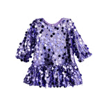 The Mabel + Honey Shake it Off Dress is a dazzling lavender long sleeve sequin fit and flare party dress for girls, featuring shimmering sequins and a ruffled skirt—perfect for special occasions where she wants to shine. Displayed on a white background, this eye-catching party dress combines comfort with sparkle for every celebration.