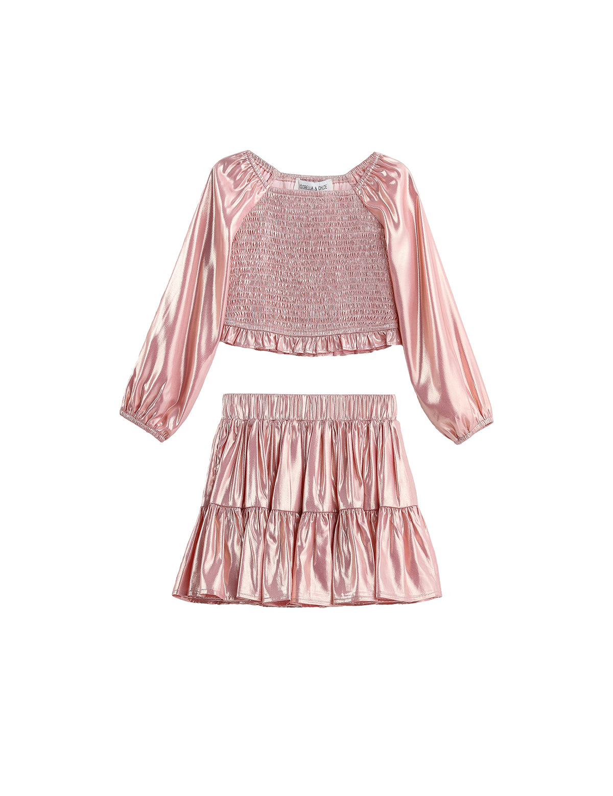 The Rosy Glow Two Piece Set by Mabel + Honey features a shiny pink metallic rose gold long-sleeve smocked crop top with gathered detailing, paired with a matching tiered skirt adorned with playful ruffles.