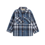 The Mabel + Honey Hunter Shirt is a blue and white plaid flannel shirt for children, featuring long sleeves, a collared neckline, front button closure, and two chest pockets. Made from soft brushed flannel for all-day comfort.
