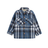 The Mabel + Honey Hunter Shirt is a blue and white plaid flannel shirt for children, featuring long sleeves, a collared neckline, front button closure, and two chest pockets. Made from soft brushed flannel for all-day comfort.