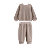 The Beckett and Bear Levi Long Sleeve Solid Ribbed Sweatshirt and Jogger Set is a cozy two-piece heathered taupe outfit for toddlers. Featuring textured ribbed knit fabric, both the sweatshirt and matching jogger pants have ribbed cuffs and are perfect loungewear for fall, displayed here on a white background.