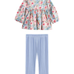 Mabel + Honey introduces the Floral Flutter Two Piece Set—a long sleeve, ruffle shoulder top with a watercolor floral design, paired with light blue leggings—all beautifully displayed on a white background.