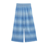The Nova Wide Leg Ombre Ribbed Knit Pants by Mabel and Honey are shown laid flat on a white background. These pants feature a blue ombre ribbed knit design, an elastic waistband, and a loose, comfortable fit.